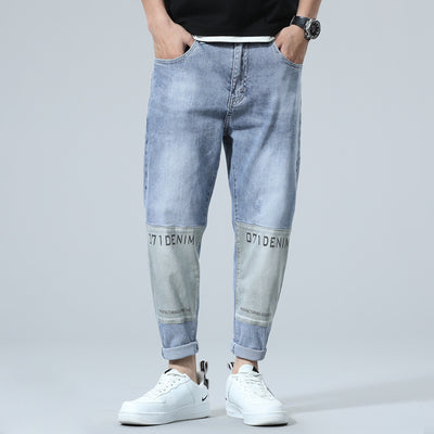 Spring and Autumn Men's Casual Brand Elasticity Simplicity fashion Splicing printing Harlan Jeans Trendy Light blue Straight